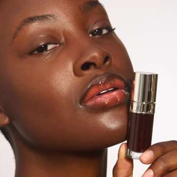 Clarins Lip Comfort Oil | Soothes, Comforts, Hydrates and Protects Lips | Sheer, High Shine Finish | Visibly Plumps | 93% Natural Ingredients | Organic Sweetbriar Rose Oil, Rich in Omega-6 and Omega-3