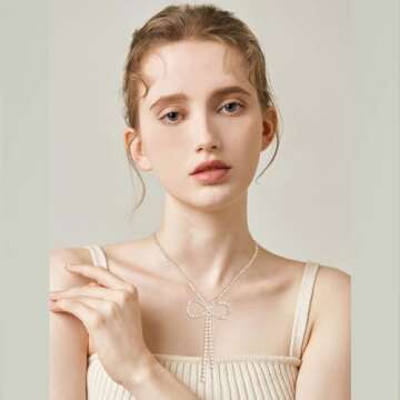 Elegant FAMARINE Gold Bow Necklace with Zirconia Sparkle