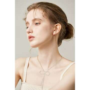 Elegant FAMARINE Gold Bow Necklace with Zirconia Sparkle
