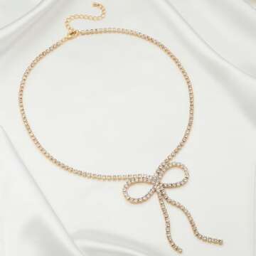 Elegant FAMARINE Gold Bow Necklace with Zirconia Sparkle