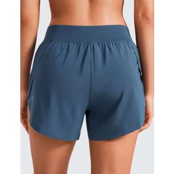 CRZ YOGA Mid Waisted Dolphin Athletic Shorts for Women 4" Lightweight High Split for Gym Workout with Liner Quick Dry Stelindigo Small