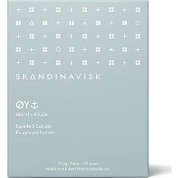 Skandinavisk ØY 'Island' Scented Candle. Fragrance Notes: Crabapple and Dog Rose, Water Mosses and Green Leaves. 7.0 oz.