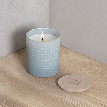 Skandinavisk ØY 'Island' Scented Candle. Fragrance Notes: Crabapple and Dog Rose, Water Mosses and Green Leaves. 7.0 oz.