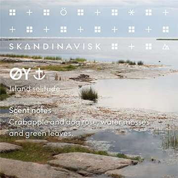 Skandinavisk ØY 'Island' Scented Candle. Fragrance Notes: Crabapple and Dog Rose, Water Mosses and Green Leaves. 7.0 oz.