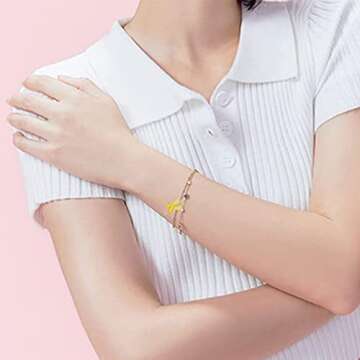 WANDIC 50 Pcs Yellow Ribbon Pendants, Hope Sacroma Bone Cancer Bladder Cancer Awareness Alloy Awareness Ribbon Charms for Jewelry Making