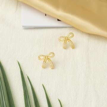 YUJIE Gold Sparkly Bow Stud Earrings Bow Rhinestone Earrings for Women Wedding Prom Fashion Jewelry