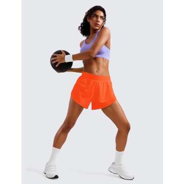 CRZ YOGA Mid Waisted Dolphin Athletic Shorts for Women 4" Lightweight High Split for Gym Workout with Liner Quick Dry Neon Orange Medium