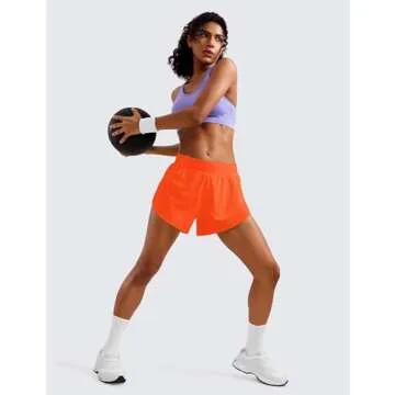 CRZ YOGA Mid Waisted Dolphin Athletic Shorts for Women 4" Lightweight High Split for Gym Workout with Liner Quick Dry Neon Orange Medium