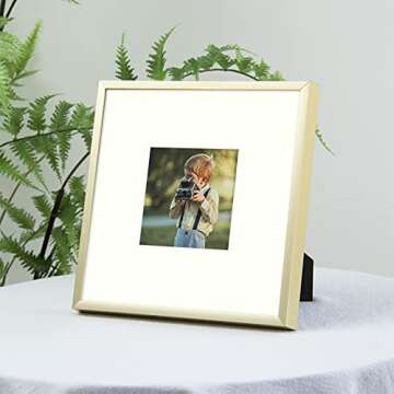 Frametory, 8x8 Gold Aluminum Picture Frame - Set of 1 - Ideal for Displaying 4x4 Photos with Mat or 8x8 Without Mat - Real Glass Front - Simple Gallery Wall Frames for Art Prints and Posters