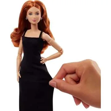 Barbie Basics Model 04 Collector Doll with Red Curly Hair, Black Mini Dress & Boots, Universal-fit Fashions, Posable Petite Body & Swappable Doll Head