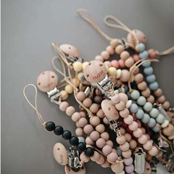 Cleo Pacifier Clip in White for Stylish Baby Essentials