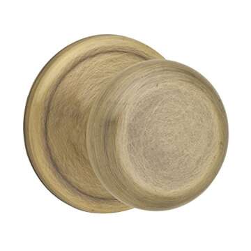 Kwikset Juno Interior Passage Door Knob - Antique Brass with Microban Protection