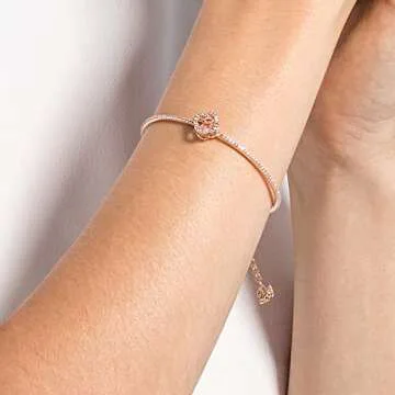 Swarovski Una Clover Bangle Bracelet with a Pink Crystal Surrounded by White Crystal Pavé on a Rose-Gold Tone Finished Band