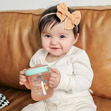 The First Years - Soft Spout Sippy Cup - Toddler Trainer Cup for 6+ Months -with Handles and Leak Proof Lid - 7 Oz - Floral Ladybug Print - 2 Count