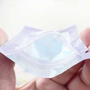 Xinhongo 100 Pack Resealable Mylar Bags Smell Proof Bags Packaging Plastic Ziplock Bag with Clear Holographic Rainbow Window Mylar Storage Bags For Candy,Jewelry,Screw (Purple, 3.93 x 7.08 inch)