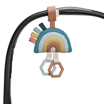 Itzy Ritzy Jingle Travel Toy for Stroller, Car Seat or Activity Gym - Baby Hanging Toy Features Jingle Sound, Clinking Rings & Adjustable Attachment Loop (Rainbow)