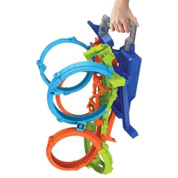 Hot Wheels Track Set with 4 Loops, 3-Way Crash Zone & Motorized Booster, Folds for Storage, with 1:64 Scale Toy Car