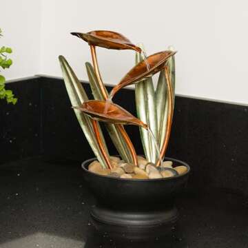 Alpine Corporation ZEN922 Indoor Tabletop Multi-Tiered Metal Tropical Leaf Water Fountain with Stone-Filled Base, 12"
