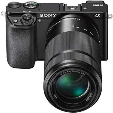 Sony Alpha a6000 Mirrorless Camera with 16-50mm and 55-210mm Power Zoom Lenses Bundle with 50MM F2.0 Sony SLR Lens, 32GB Memory Card, Camera Bag and Accessories (7 Items)