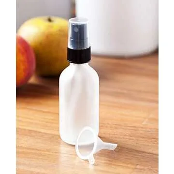 JUVITUS 2 oz Frosted Clear Glass Boston Round Bottle with Black Mist Spray (12 Pack) for Cosmetics, serums, Carrier and Essential Oils, Aromatherapy