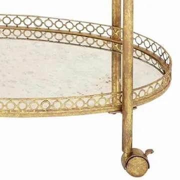 Deco 79 Oval Bar Cart with Mirrored Shelves in Gold