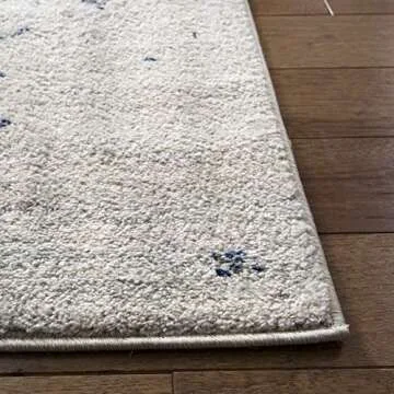 SAFAVIEH Madison Collection Area Rug - 6'7" x 9'2", Cream & Navy, Snowflake Medallion Distressed Des...