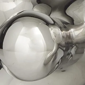 CosmoLiving Abstract Decorative Sculpture in Silver