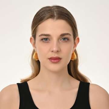 SHERLOVE Gold Earrings for Women Trendy,Dupes Earrings Lightweight Hollow Fin Shaped 18K Gold Plated...