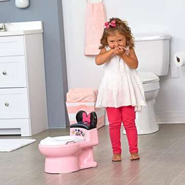 The First Years Disney Minnie Mouse Potty Training Toilet and Toddler Toilet Seat - Toilet Training Potty with Fun Flushing and Cheering Sounds,Pink