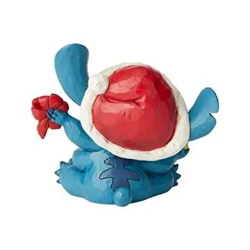 Enesco Disney Traditions by Jim Shore Lilo and Stich Santa Stitch Wrapping Present Figurine, 5.25 Inch, Multicolor