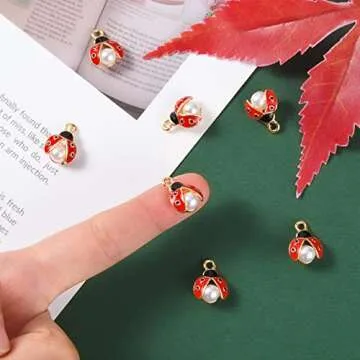 LiQunSweet 100 Pcs Enamel Ladybug Charms Mini Flying Animal Ladybirds Beetle Insect Charm with Faux Pearl Bulk for Jewelry Making DIY Findings
