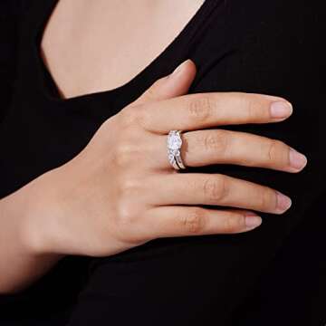 Amazon Essentials Sterling Silver Platinum Plated Infinite Elements Cubic Zirconia Three Stone Ring,...