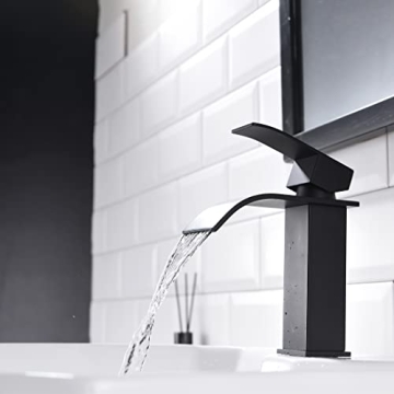 Elegant White Ceramic Bathroom Sink with Black Faucet