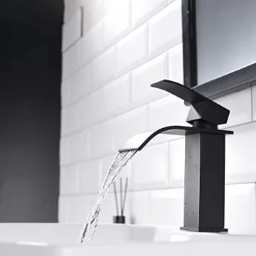 Elegant White Ceramic Bathroom Sink with Black Faucet