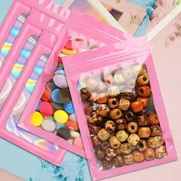 Funfery 100 pcs Pink Mylar Holographic Bags Packaging Bags,Clear Seal Resealable Smell Proof Bags Foil Pouch Bags for Food Storage and Lipgloss,Jewelry,Eyelash Packaging for Small Business(3x4.7In)