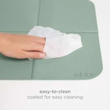 Ubbi On-The-Go Changing Baby Mat with Carrying Bag, Soft and Comfortable Diaper Bag Accessory Must Have for Newborns, Easy to Clean, Portable Changing Pad, Sage Green