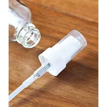 JUVITUS 2 oz / 60 ml Clear Glass Boston Round White Treatment Pump Bottle (24 pack) + Funnel