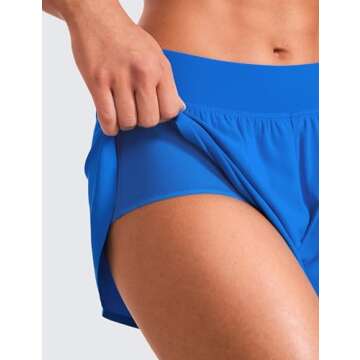 CRZ YOGA Mid Waisted Dolphin Athletic Shorts for Women 4" Lightweight High Split for Gym Workout with Liner Quick Dry Sparkle Blue XX-Small