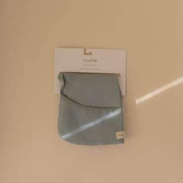 mushie Long Sleeve Baby Bib | Mess Free & Waterproof Fabric for Toddlers | Adjustable Fit for Ages 6-24 Months (Roman Green)