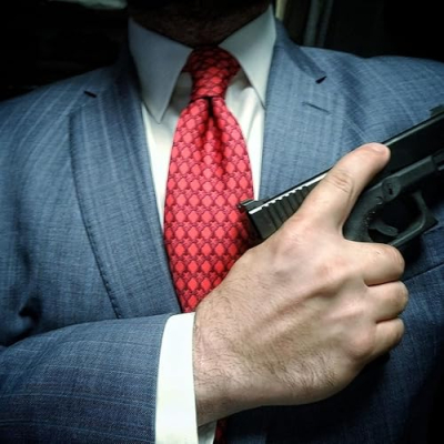 The Suited Shootist Profile